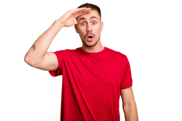 Young caucasian man cut out isolated shouts loud, keeps eyes opened and hands tense.