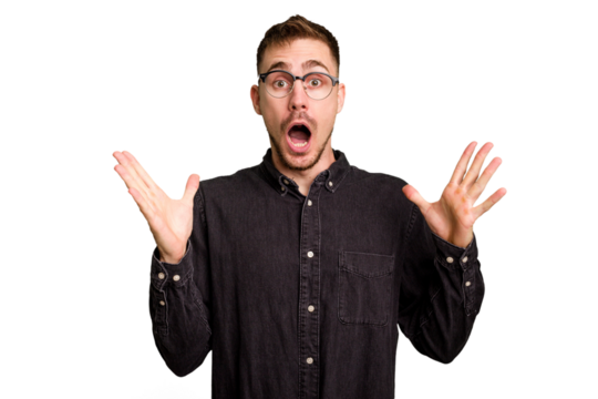 Young caucasian man cut out isolated celebrating a victory or success, he is surprised and shocked.