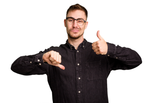 Young caucasian man cut out isolated showing thumbs up and thumbs down, difficult choose concept