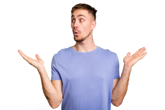 Young caucasian man cut out isolated confused and doubtful shrugging shoulders to hold a copy space.