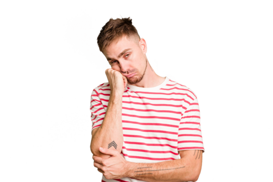 Young caucasian man cut out isolated who feels sad and pensive, looking at copy space.
