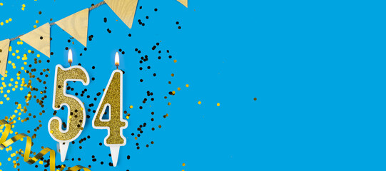 Golden candle number fifty four. Birthday or anniversary card with the inscription 54 on blue background. Anniversary celebration. Banner.