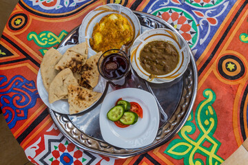 Breakfast in Egypt - fuul, bread, salad, omelette and tea