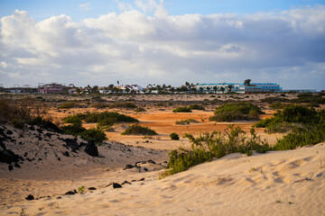 Village of Corralejo viewed from the sandy dunes of the Natural Park of Corralejo in the north of Fuerteventura island in the Canaries, Spain