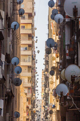 Narrow alley with satellite dishes in Alexandria, Egypt