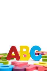 ABC letters English alphabet among multicolored letters white background.
