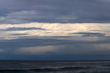 Naklejka na ściany i meble Rain clouds in the sky over the Mediterranean Sea in northern Israel.