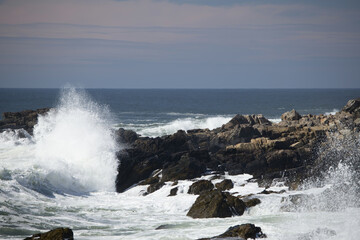 Ocean waves crashing against a rocky shore