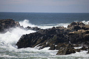 Ocean waves crashing against a rocky shore