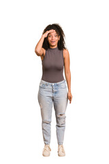 Young african american woman with curly hair cut out isolated shouts loud, keeps eyes opened and hands tense.