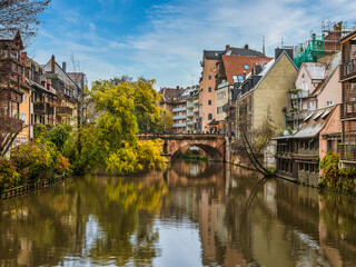 Fototapeta na wymiar Beautiful village buildings and Karls bridge on Pegnitz river in Nuremberg, Germany.tif