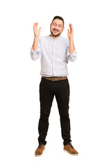 Fototapeta premium Full body adult latin man cut out isolated joyful laughing a lot. Happiness concept.