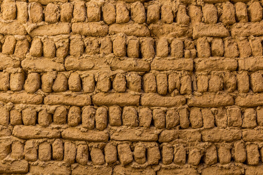 Detail of mud brick wall in Al Qasr village in Dakhla oasis, Egypt