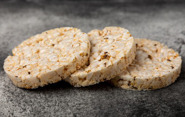 Rice cakes on a black table. Bread. Airy rice bread. dietary crispy round rice cakes. Place for text. Place to copy. Healthy food. dietary product.