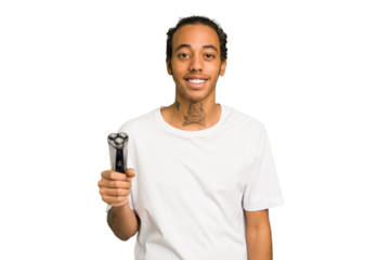 Young African American man holding a razor isolated happy, smiling and cheerful.