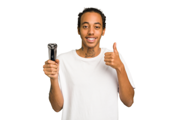 Young African American man holding a razor isolated smiling and raising thumb up