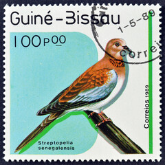 Cancelled postage stamp printed by Guinea Bissau, that shows Laughing Dove (Streptopelia...