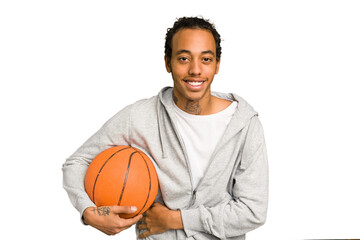 Young african american man playing basketball isolated laughing and having fun.