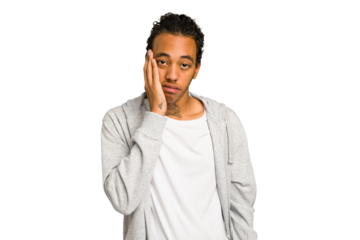 Young African American man isolated who feels sad and pensive, looking at copy space.