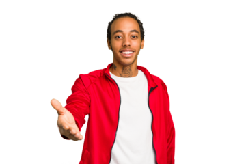 Young African American man isolated stretching hand at camera in greeting gesture.