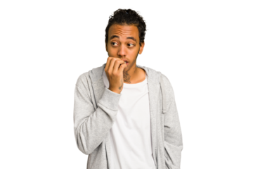 Young African American man isolated biting fingernails, nervous and very anxious.