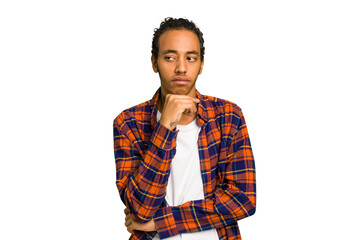Young African American man isolated looking sideways with doubtful and skeptical expression.