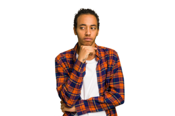Young African American man isolated looking sideways with doubtful and skeptical expression.