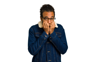Young African American man isolated biting fingernails, nervous and very anxious.