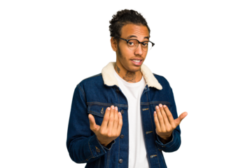 Young African American man isolated pointing with finger at you as if inviting come closer.
