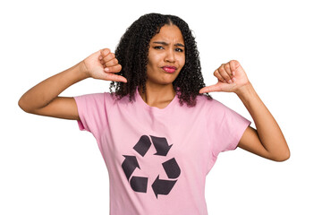 Young african american woman wearing a recycle t-shirt cutout isolated feels proud and self...