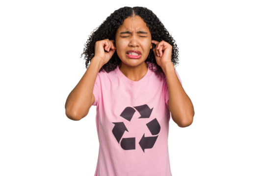 Young african american woman wearing a recycle t-shirt cutout isolated covering ears with hands.