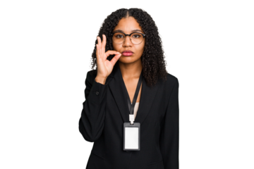 Young african american business woman with ID card isolated with fingers on lips keeping a secret.