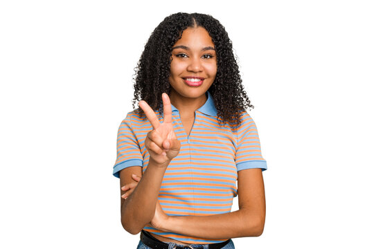 Young african american woman with curly hair cut out isolated showing victory sign and smiling broadly.
