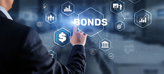 Businessman clicks a bonds virtual screen. Bond Finance Banking Technology concept. Trade Market Network