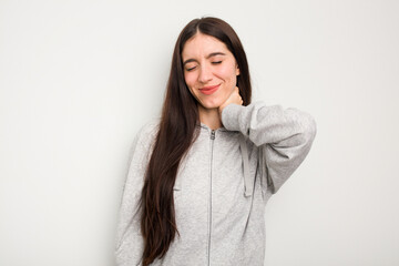 Young caucasian woman isolated on white background having a neck pain due to stress, massaging and touching it with hand.