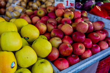 Naklejka na ściany i meble ripe autumn spanish healthy apples on a market stand