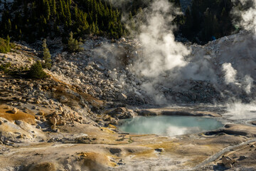 Small Blue Pond Surrounded By Boulder Field In Bumpass Hell