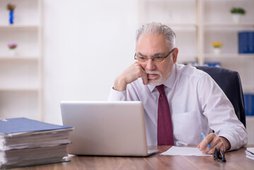 Old male employee and too much work in the office