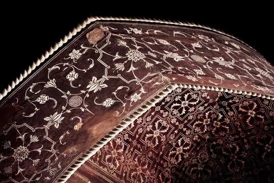 Detail of a red arch with white engravings in the mosque's ceiling, Taj Mahal, Agra, India, July, 2008
