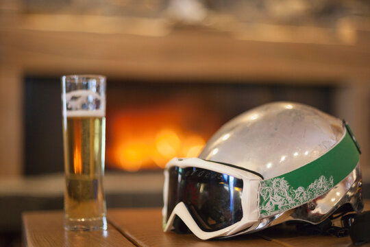 Beer after skiing in front of fireplace