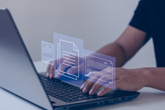 Online documentation database and document management system concept. Businessman working on laptop computer with the virtual screen. Process automation to efficiently manage files.