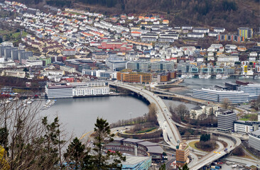 Naklejka premium Bergen is a city on Norway’s southwestern coast. It's surrounded by mountains and fjords. Bergen is the second largest city in Norway.