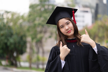 Successful graduation from university. Smiling beautiful Asian girl university or college graduate...