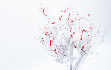 Obraz na płótnie Canvas Monochrome white background. Texture of white flowers with red blood drops on a white background. White light template for text.