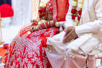 Fototapeta na wymiar Indian Hindu wedding rituals bride and groom's hands close up