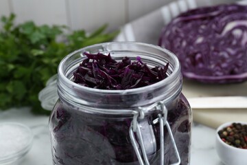 Tasty red cabbage sauerkraut on table, closeup