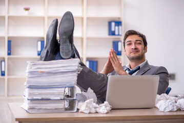 Young male employee in brainstorming concept