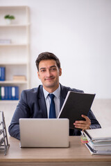 Young male employee working in the office