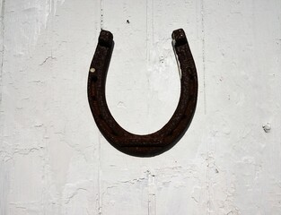 old horseshoe on wooden wall