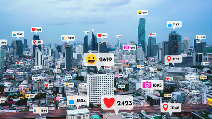 Social media icons fly over city downtown showing people reciprocity connection through social...